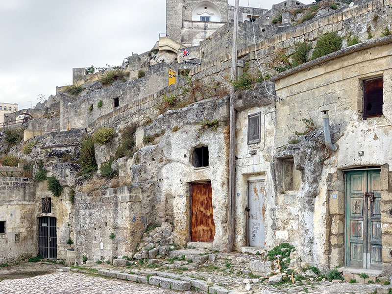 Exterior view of the stone dwellings stacked on the ravine